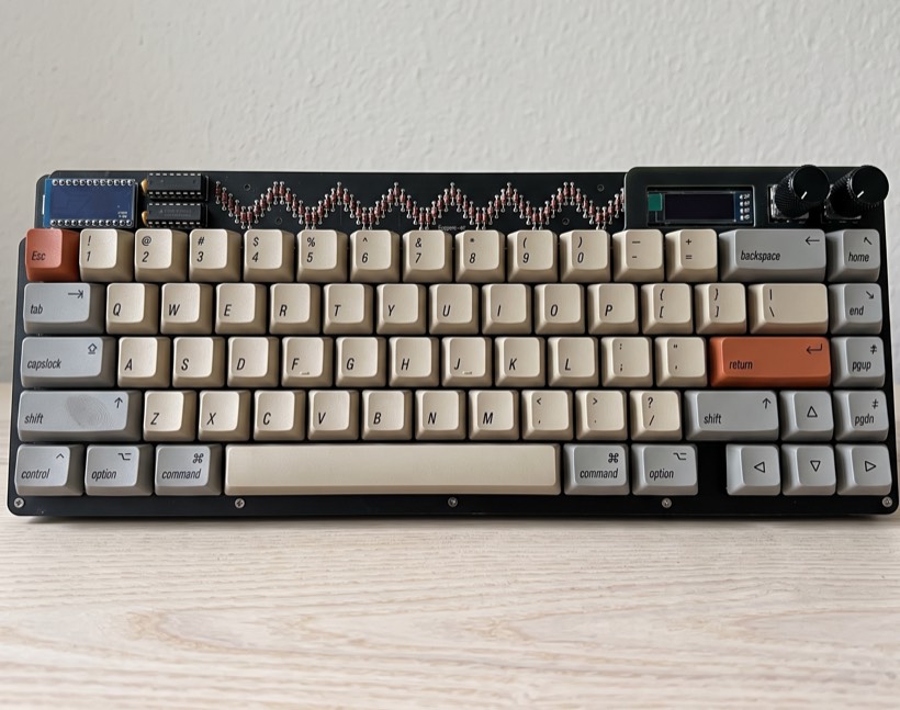 A Lagom 65% keyboard built with beige and grey keycaps, sitting on a desk